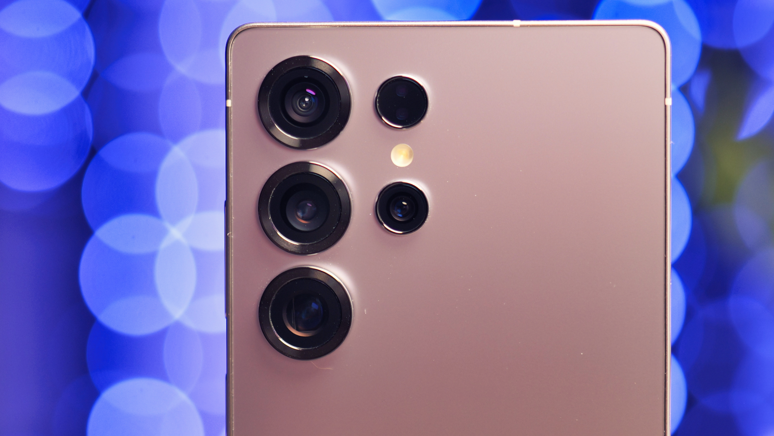 The Samsung Galaxy S26 Ultra smartphone camera captures a cityscape at night, with bright and clear footage, thanks to its AI-enhanced recording system, showcasing its low-light photography capabilities