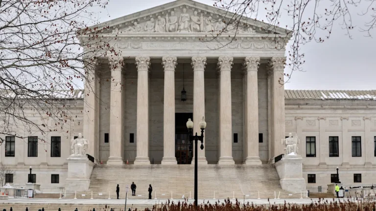 The US Supreme Court building in Washington D.C., with a flag flying high in the foreground, symbolising the court's role in shaping trade policy and upholding the law, with the primary keyword being US Supreme Court